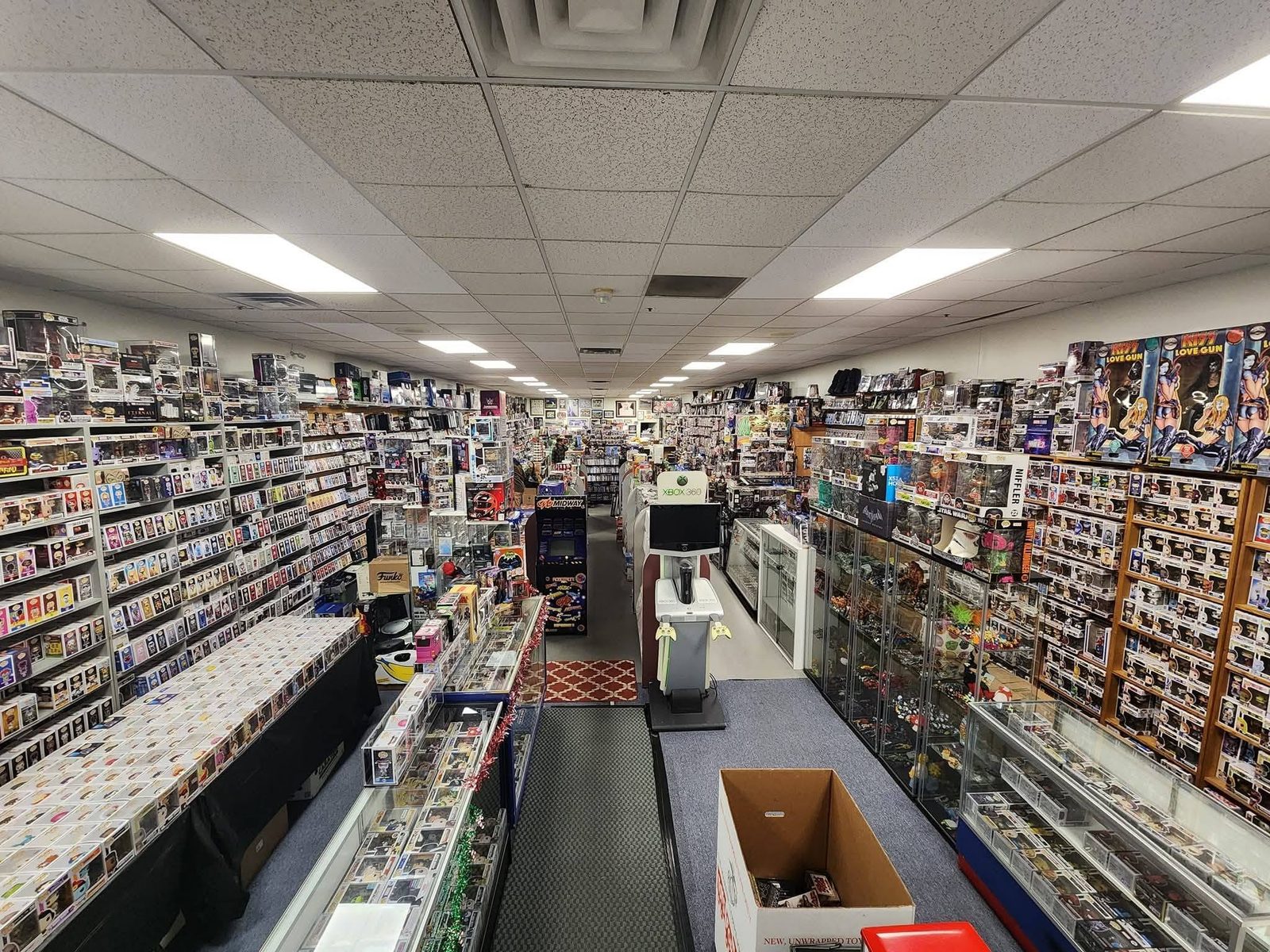 Looking down the aisle at M&J Video Games